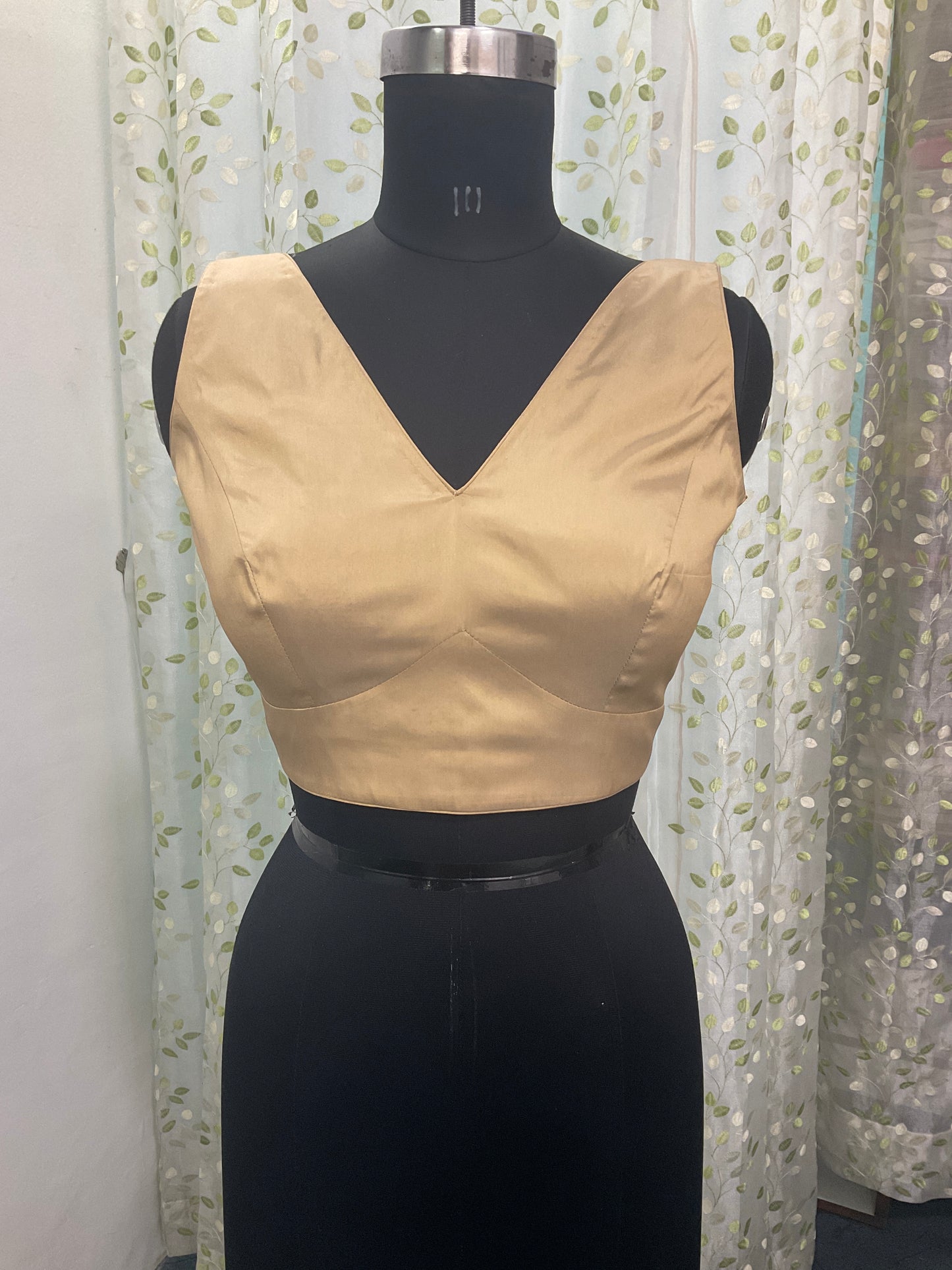 Golden sleeveless blouse