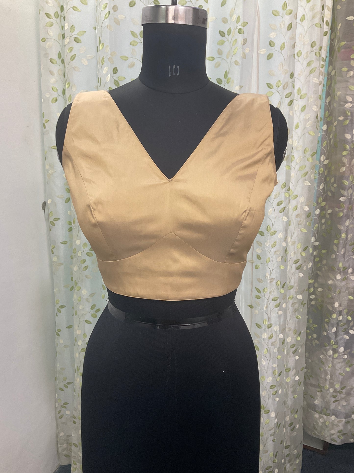 Golden sleeveless blouse