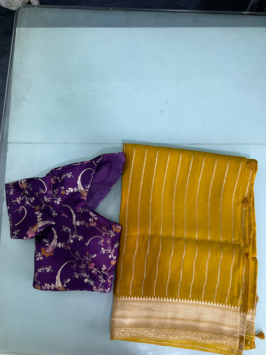 Yellow saree with purple blouse